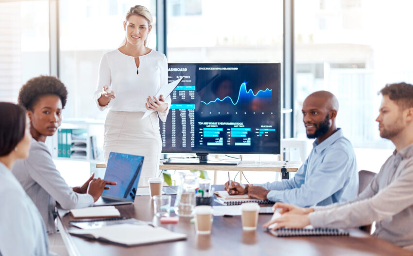 Woman, trader coach and screen with stock market dashboard, business people in meeting for training.